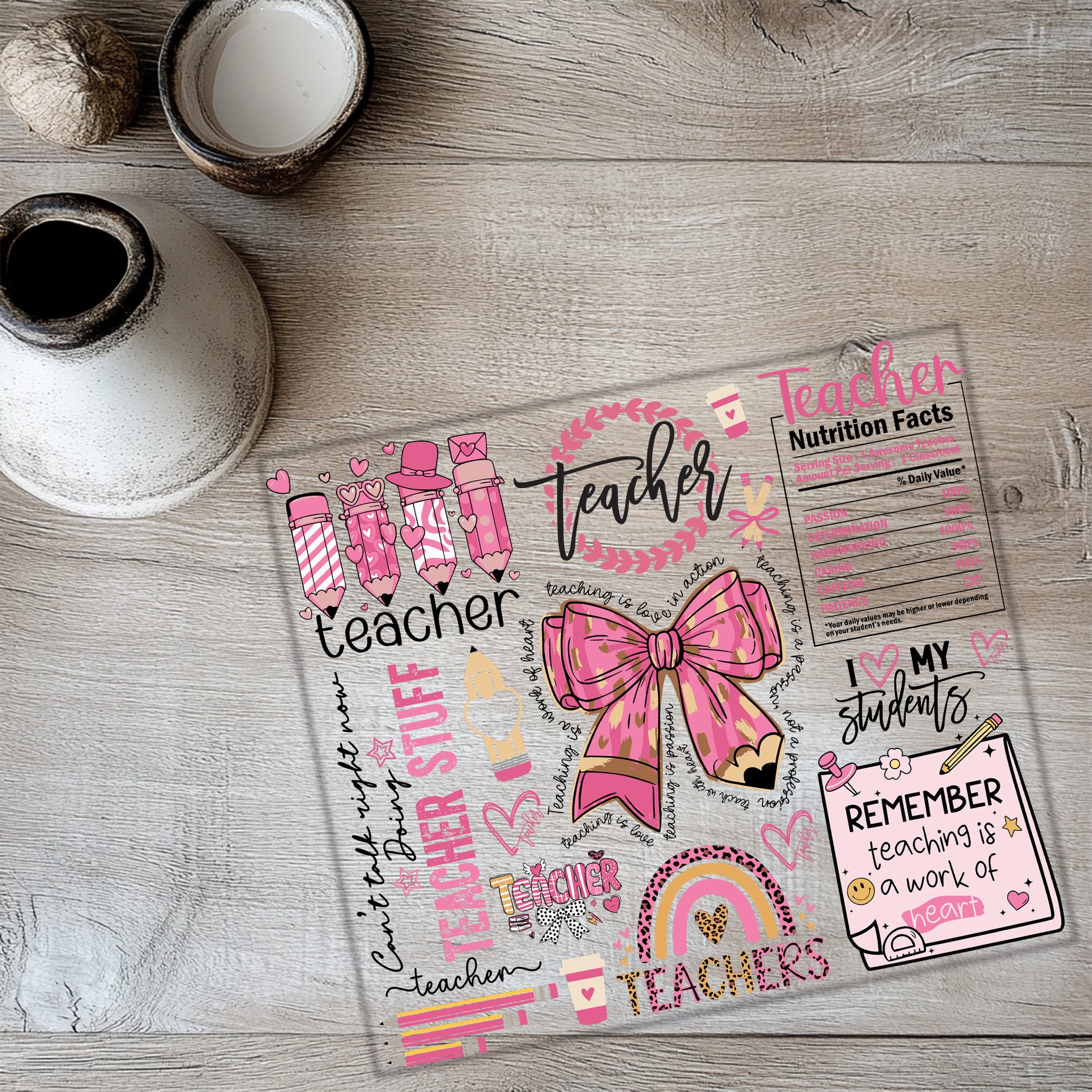 a paper with a pink bow on top of it