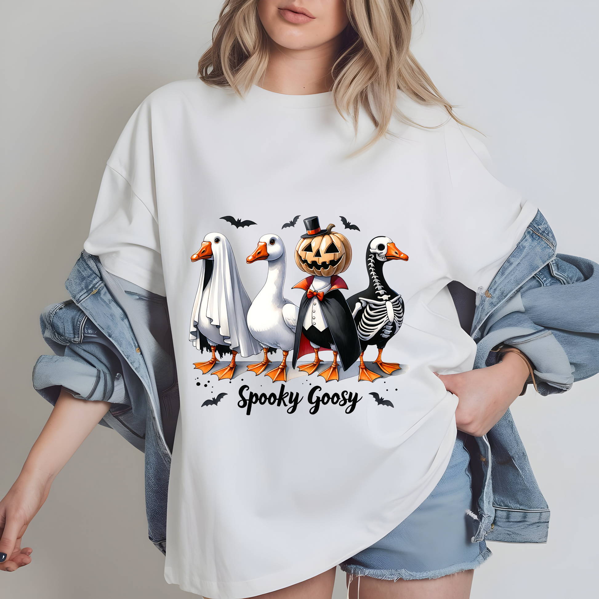 a woman wearing a white shirt with a group of penguins on it