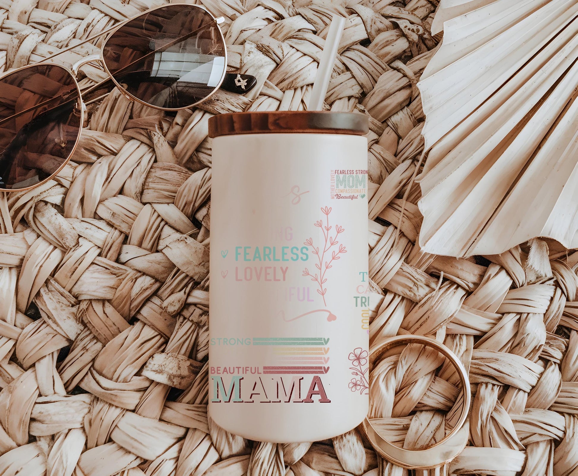 a coffee cup sitting on top of a table next to sunglasses