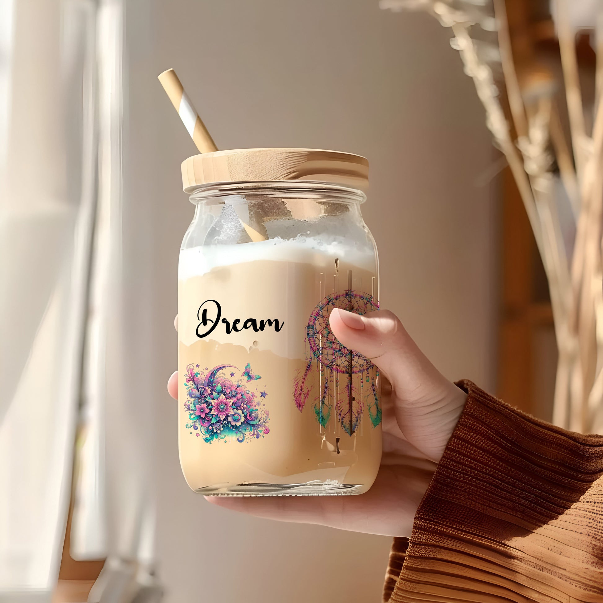 a person holding a jar with a straw in it