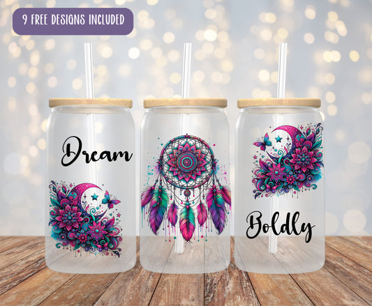three mason jars with designs on them on a wooden table