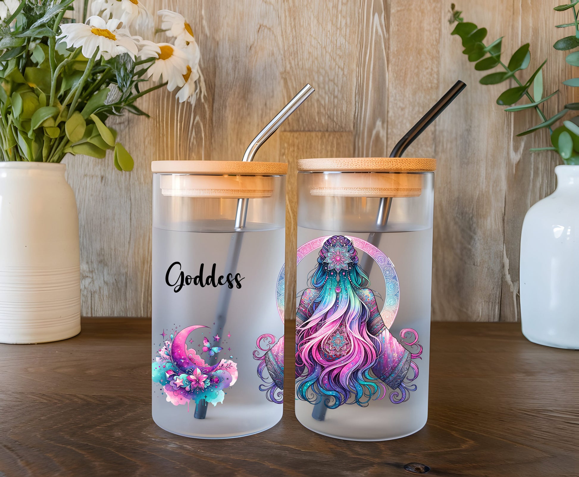 a couple of glass cups sitting on top of a wooden table