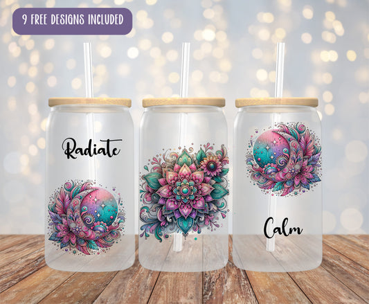 three mason jars with designs on them sitting on a table