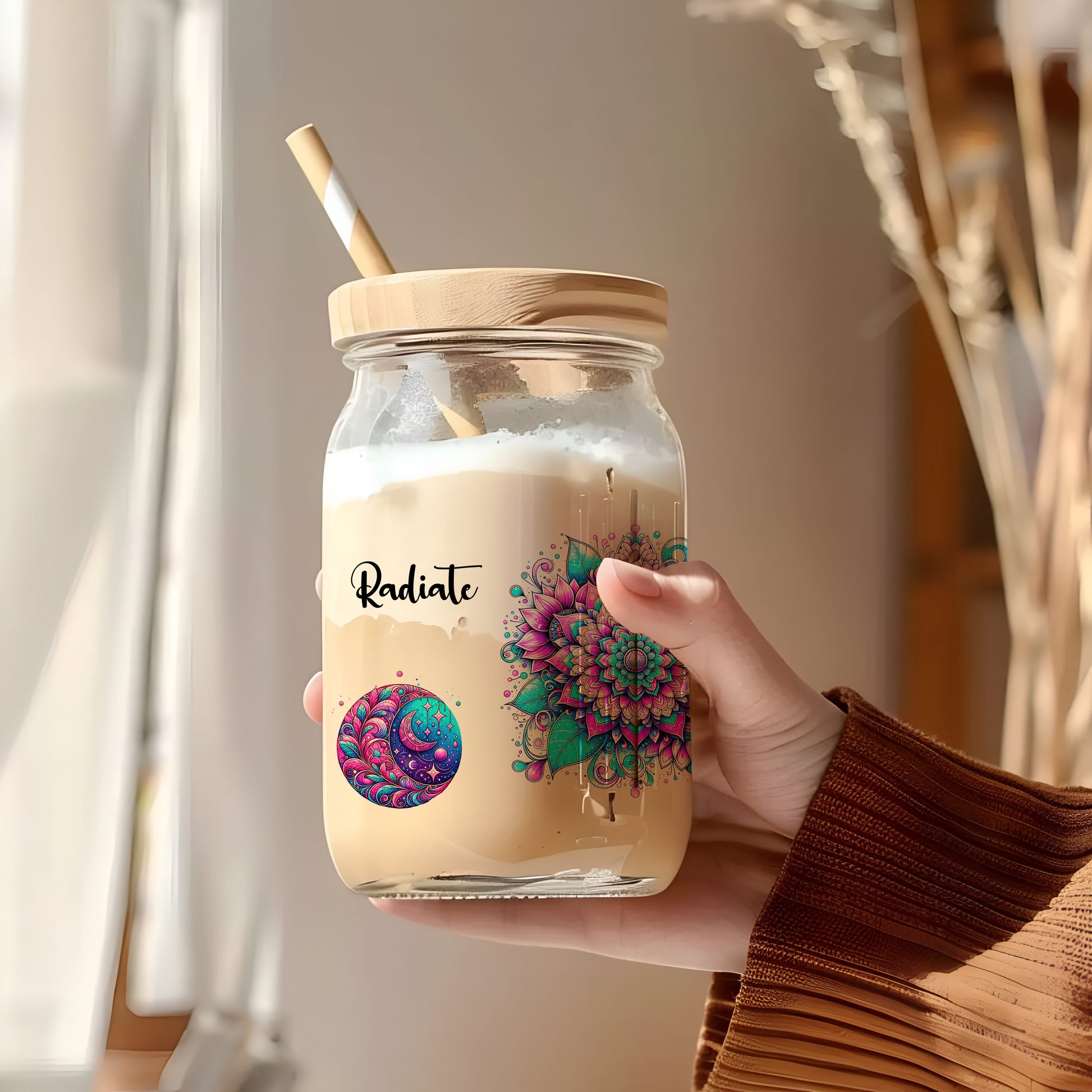a person holding a jar with a straw in it