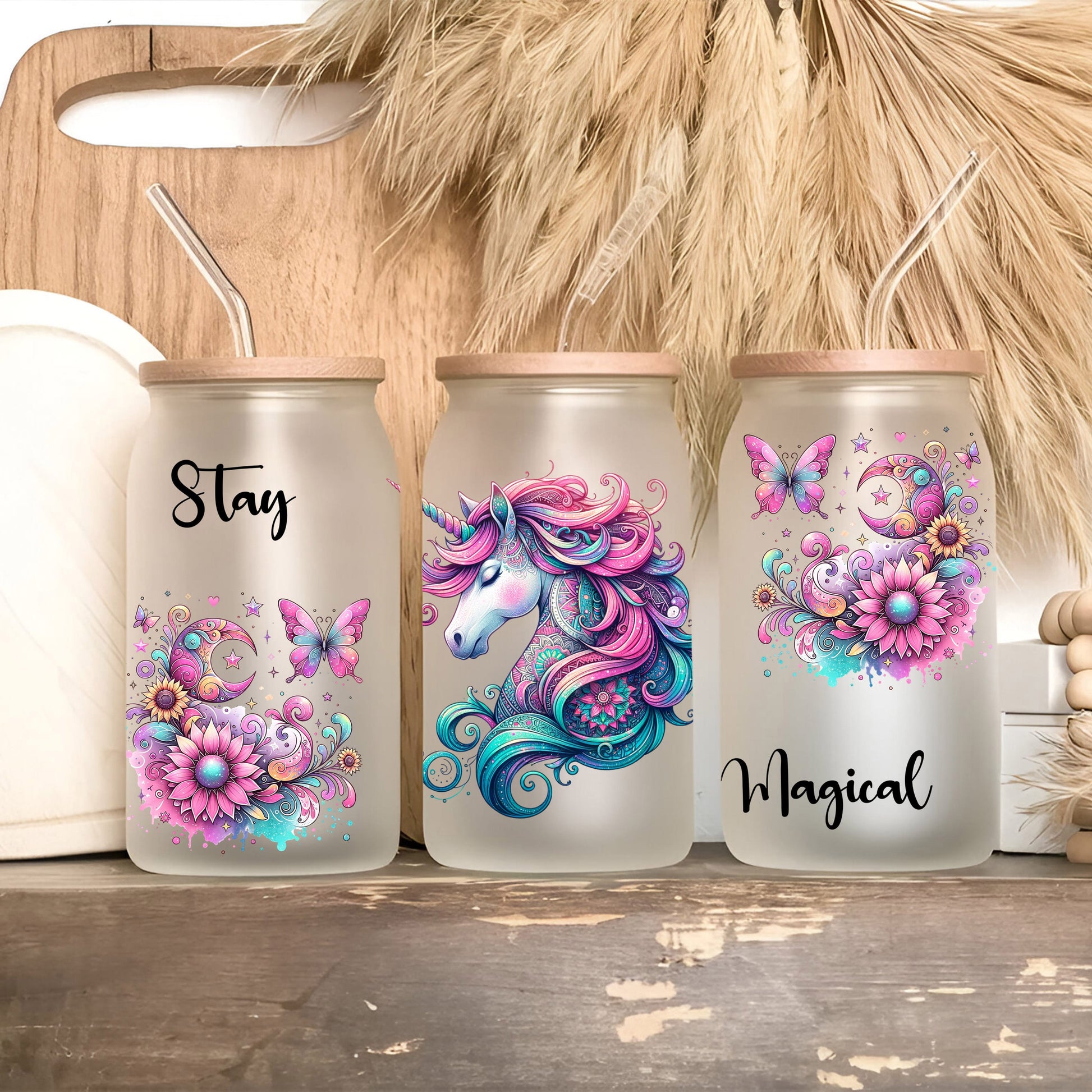 three plastic cups with designs on them sitting on a shelf