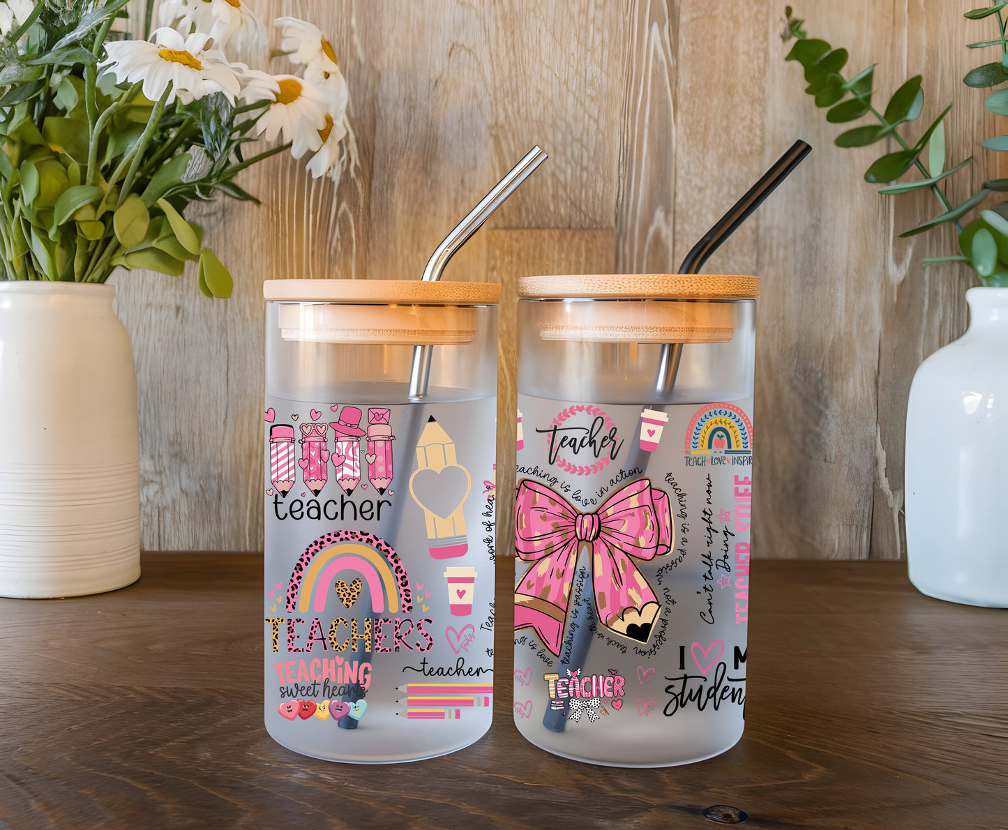 a couple of glass jars sitting on top of a wooden table