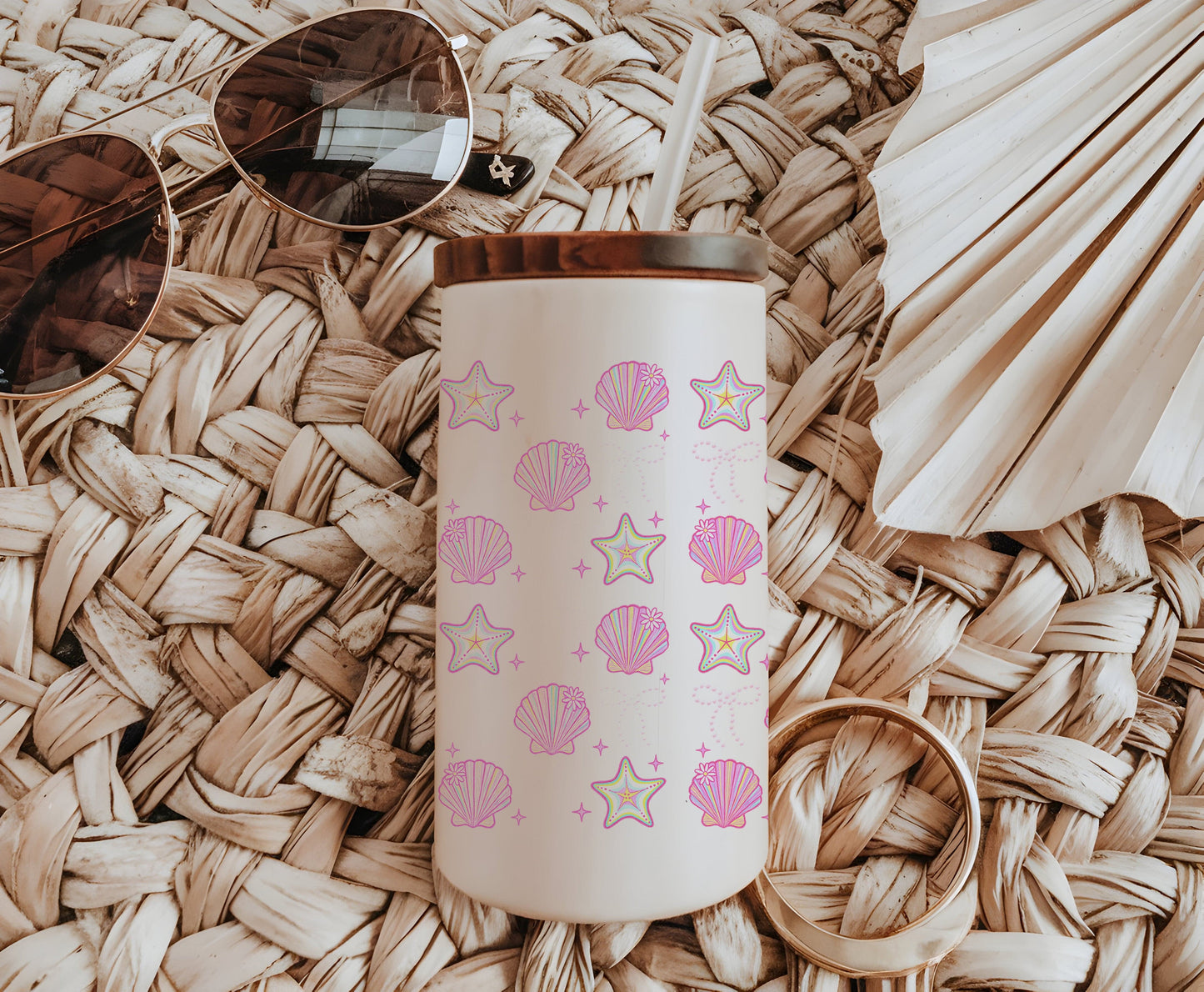 a pink and white coffee cup sitting on top of a wicker mat