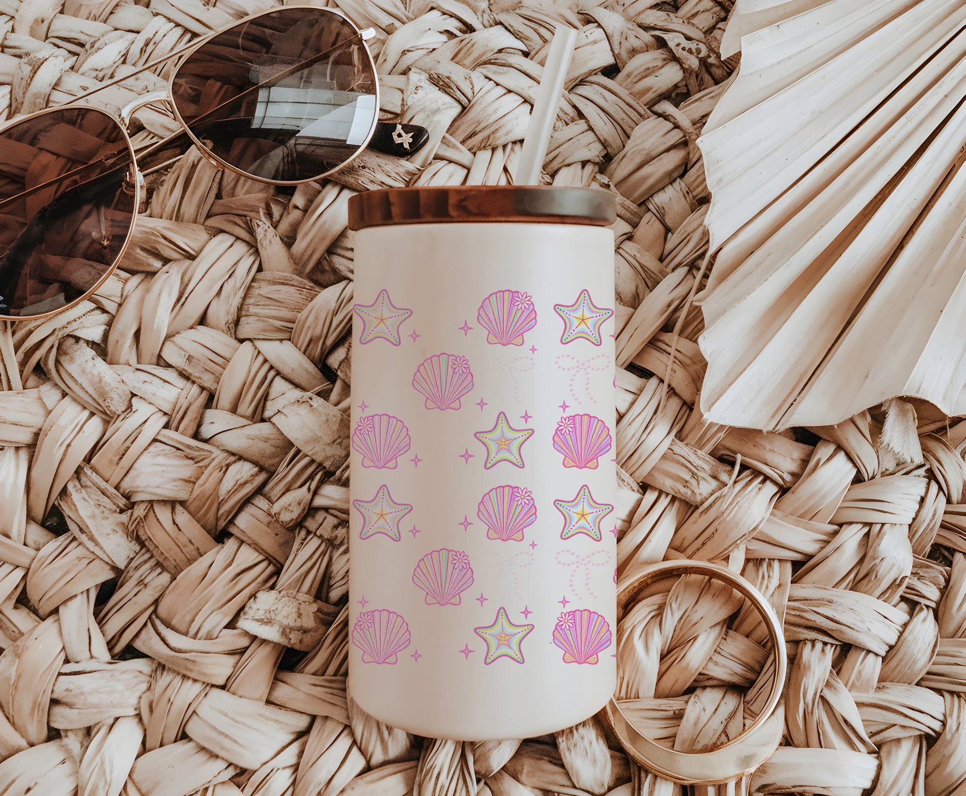 a pink and white coffee cup sitting on top of a wicker mat