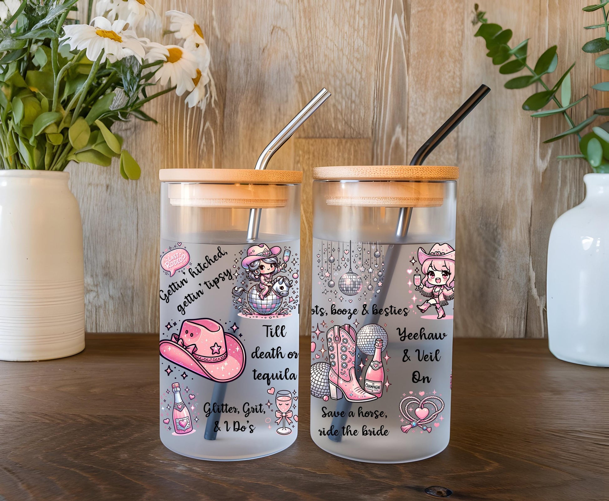 a couple of glass cups sitting on top of a wooden table