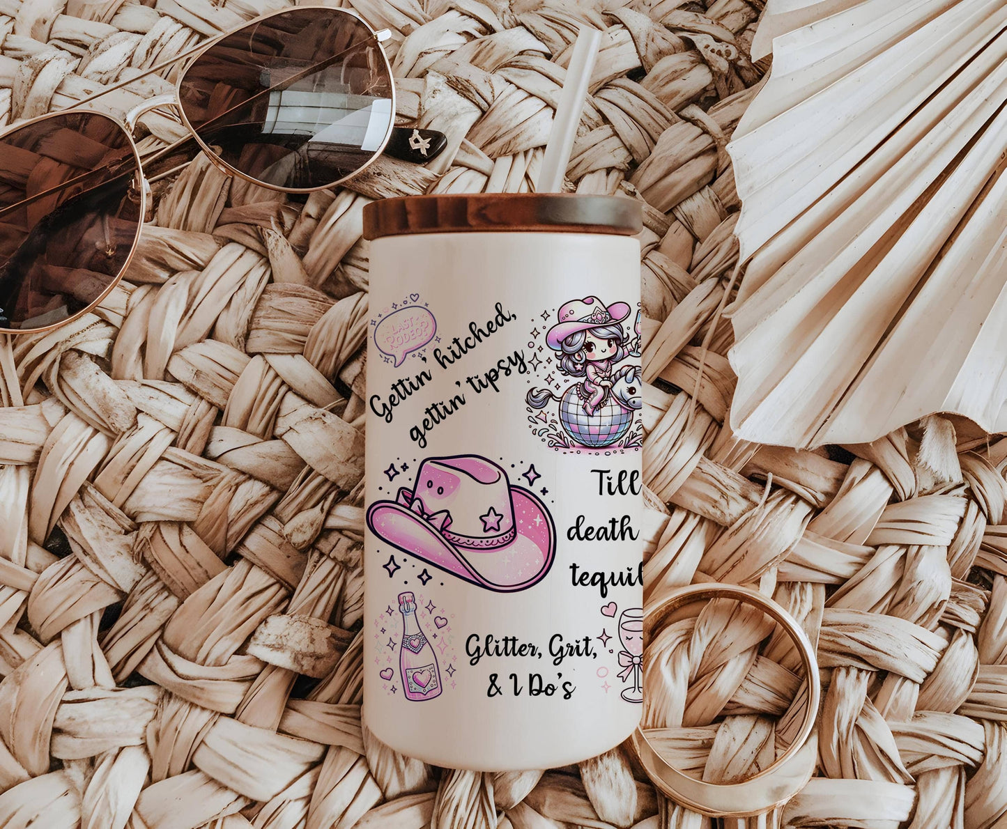a white coffee mug with a picture of a pink hat, sunglasses, and a