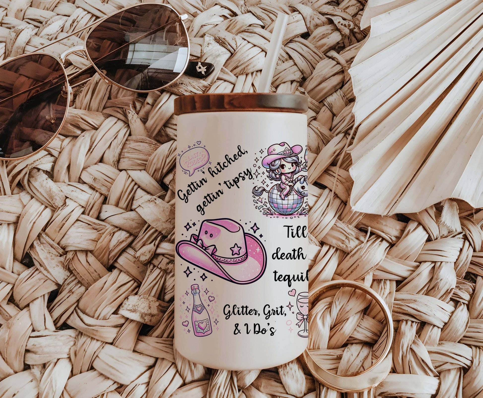 a white coffee mug with a picture of a pink hat, sunglasses, and a