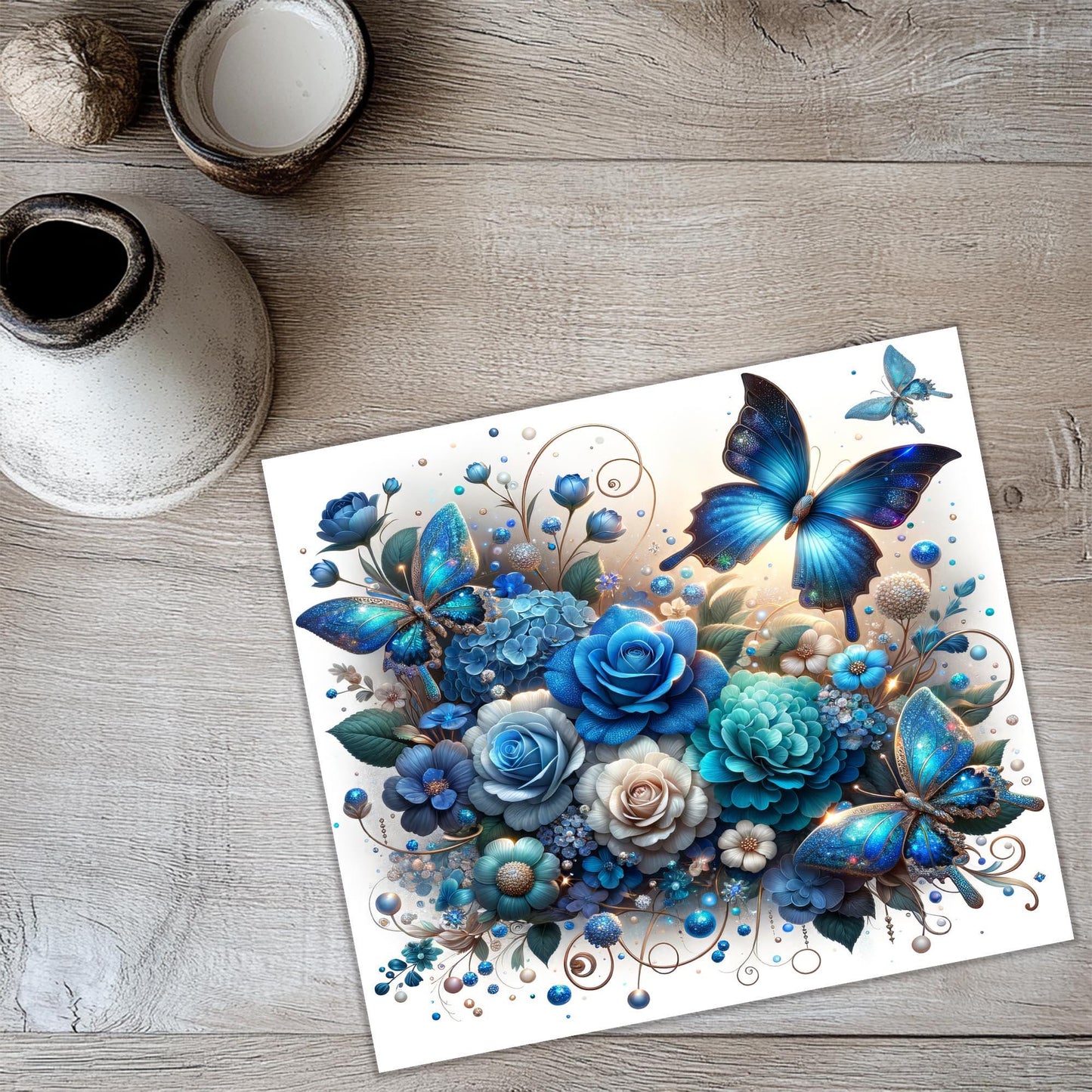 a card with blue flowers and butterflies on it