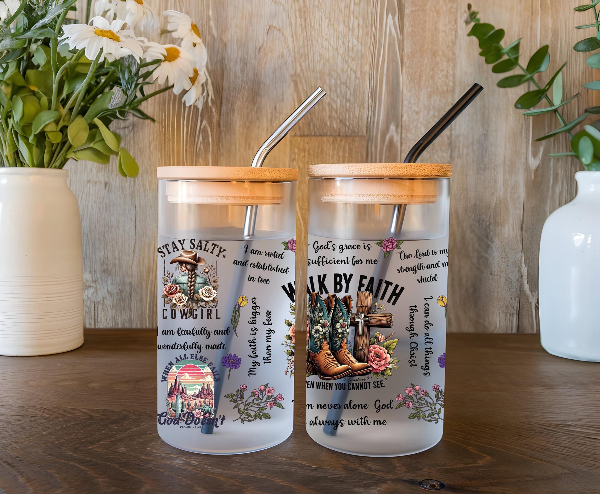 a couple of glass cups sitting on top of a wooden table