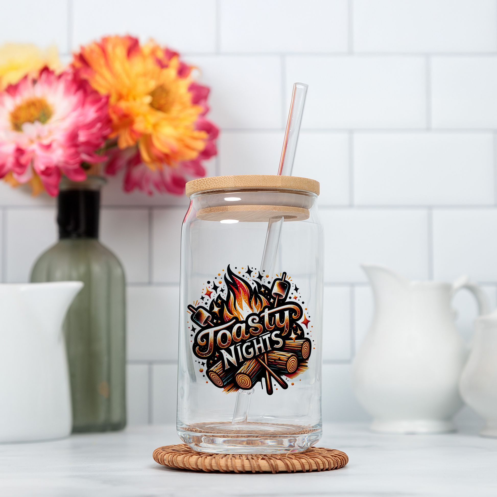 a glass jar with a straw in it sitting on a counter