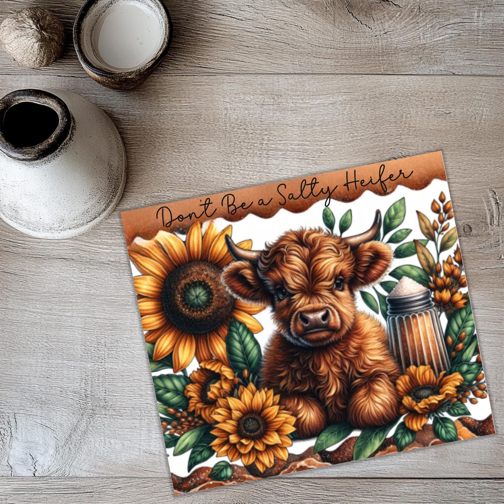 a card with a picture of a cow and sunflowers