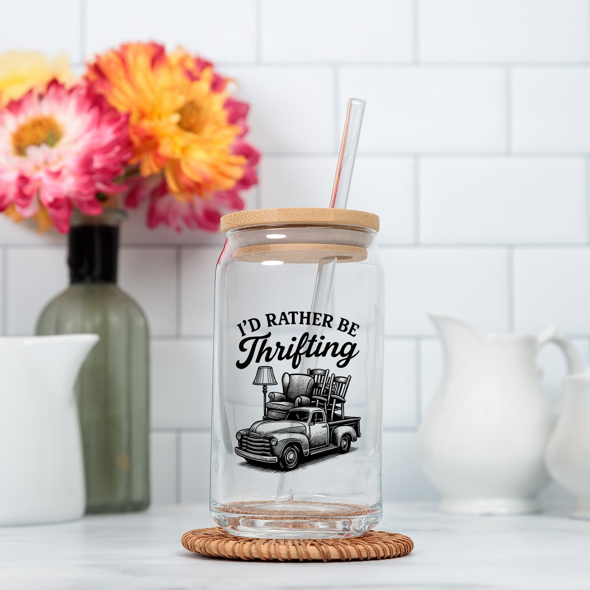 a glass jar with a straw in it sitting on a counter