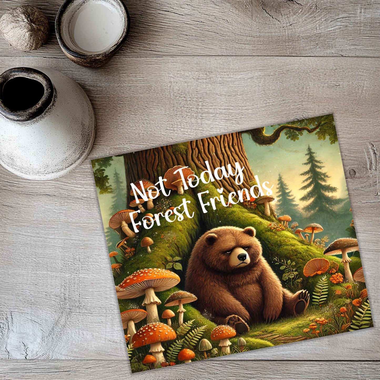 a picture of a bear sitting in a forest