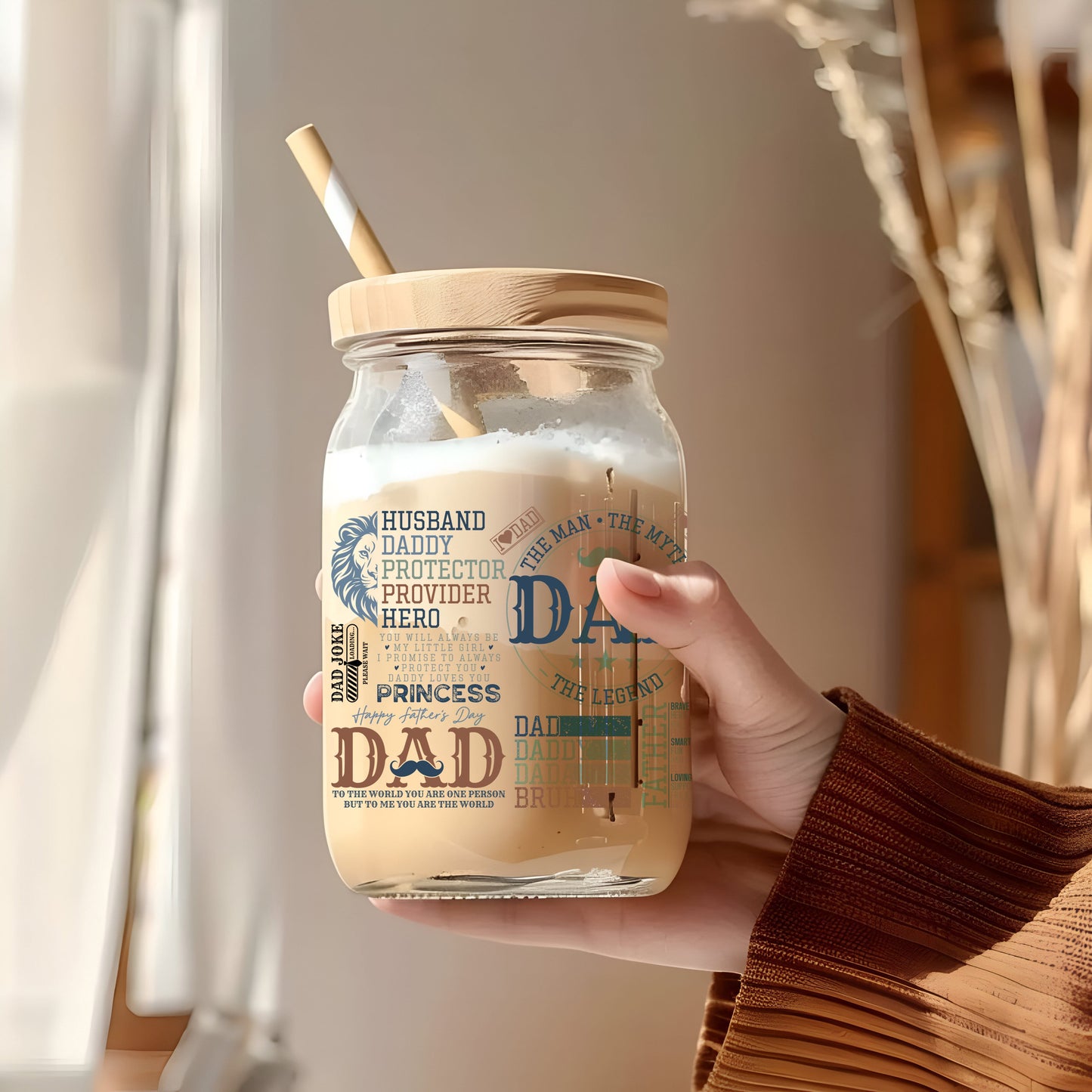 a person holding a jar with a straw in it