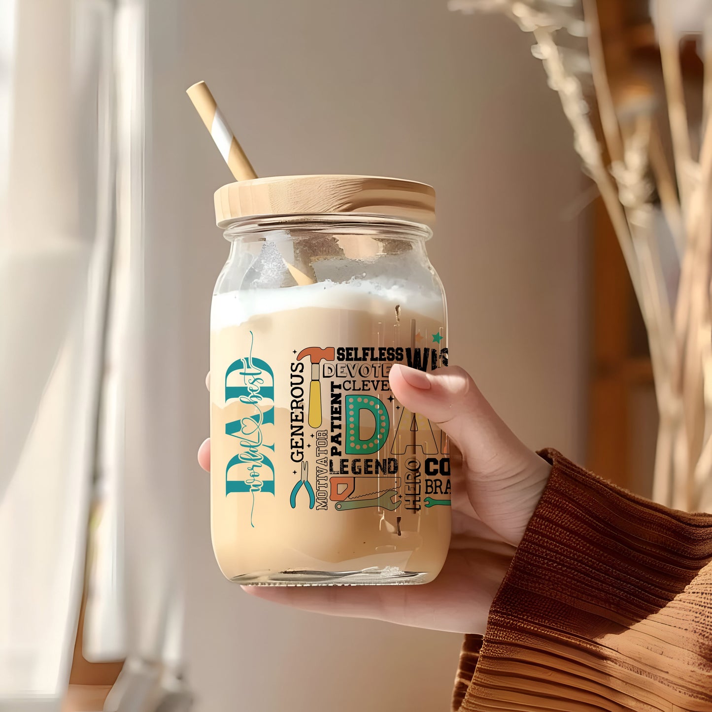a person holding a jar with a straw in it
