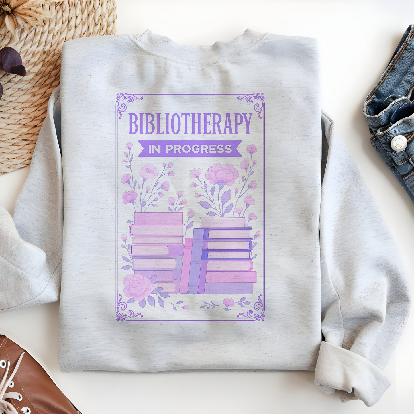 a white sweatshirt with the words bibliotherap on it