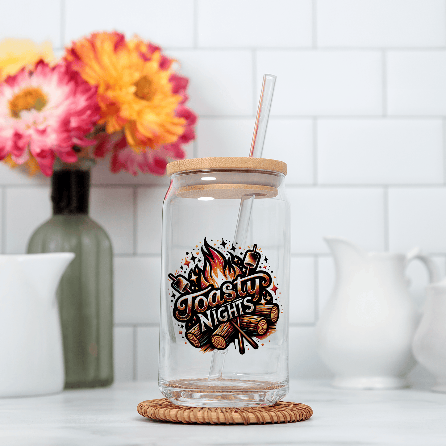a glass jar with a straw in it sitting on a counter