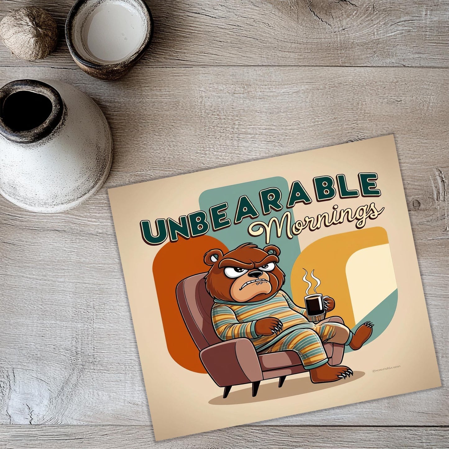 a picture of a bear sitting in a chair with a cup of coffee