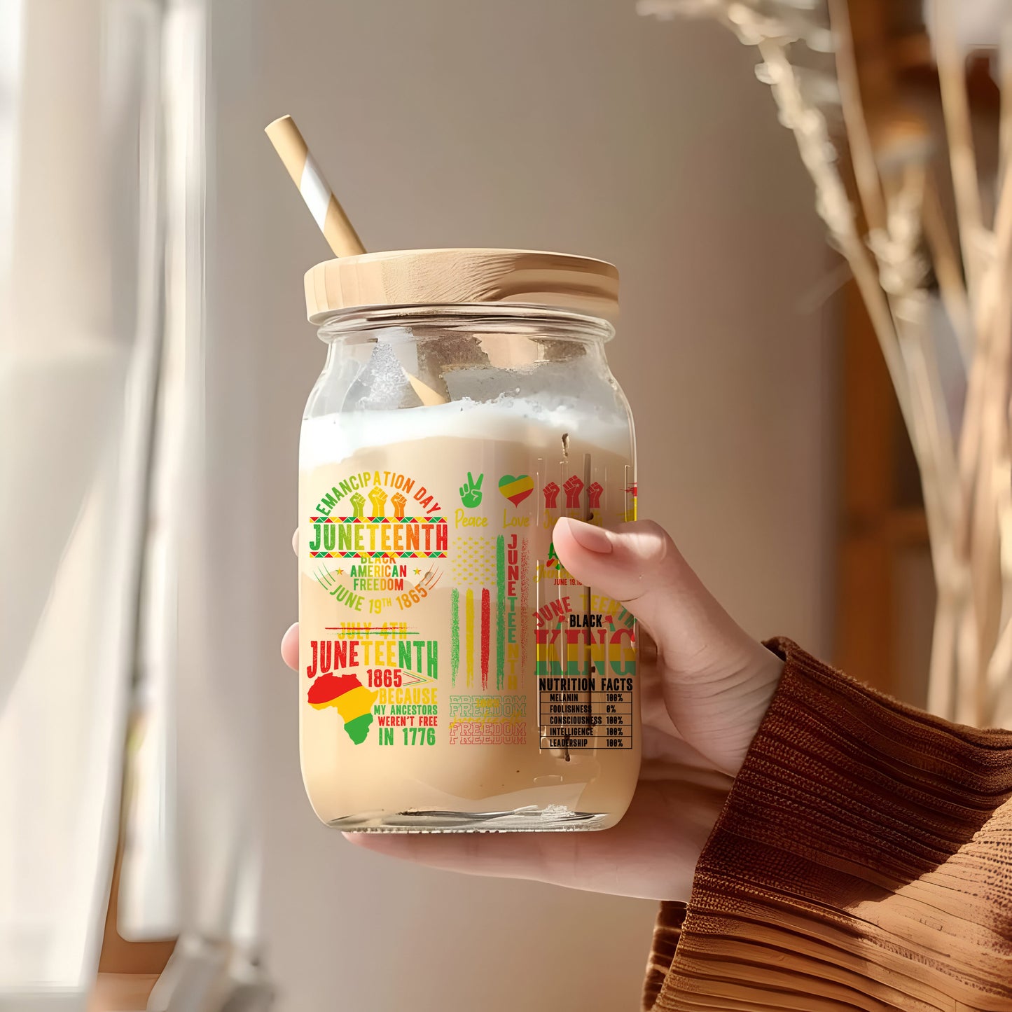 a person holding a jar with a straw in it