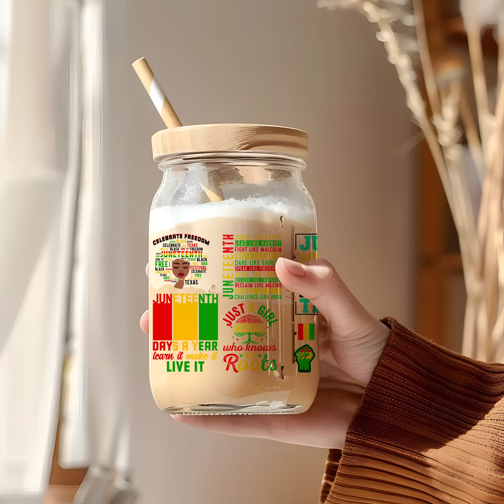a person holding a jar with a straw in it