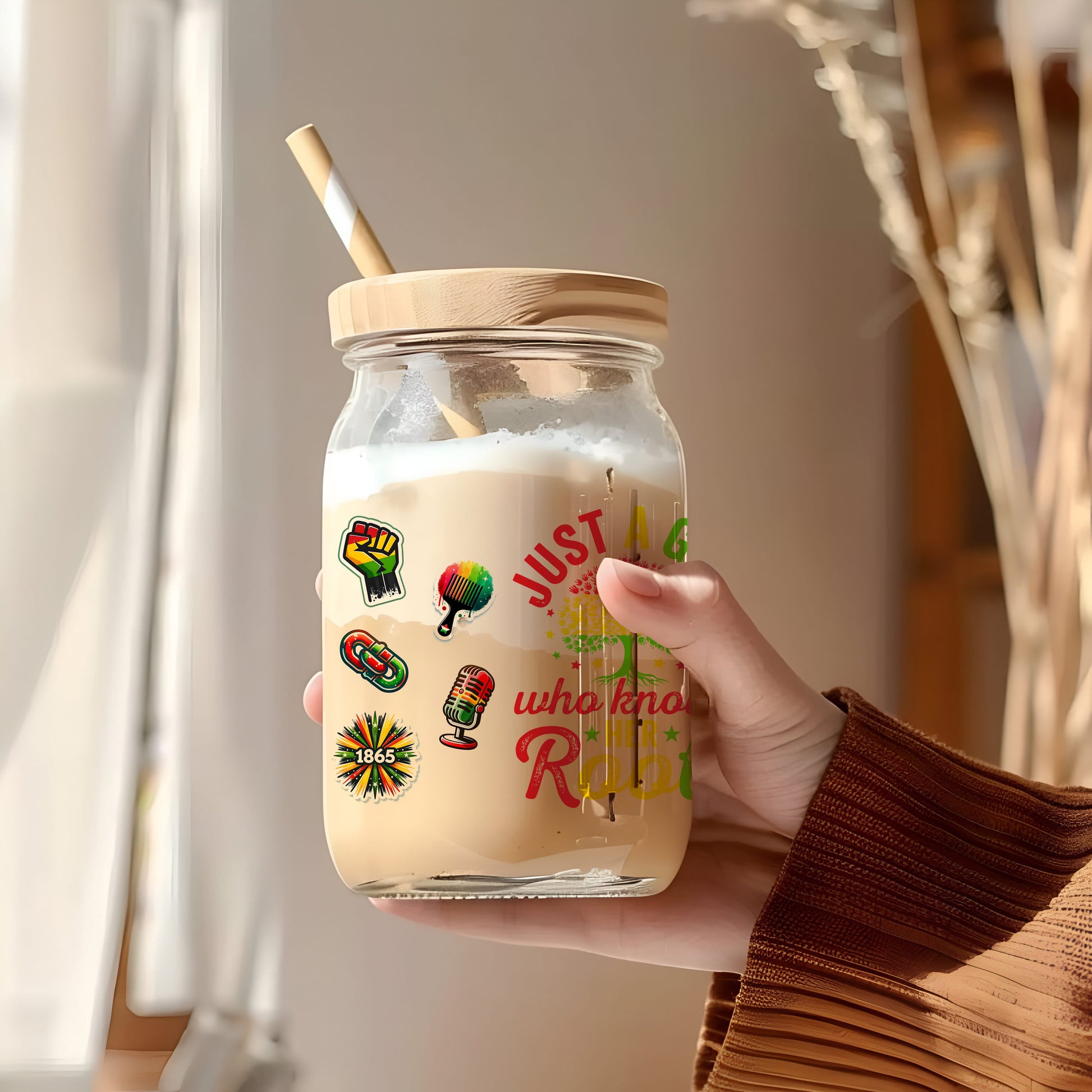 a person holding a jar with a straw in it