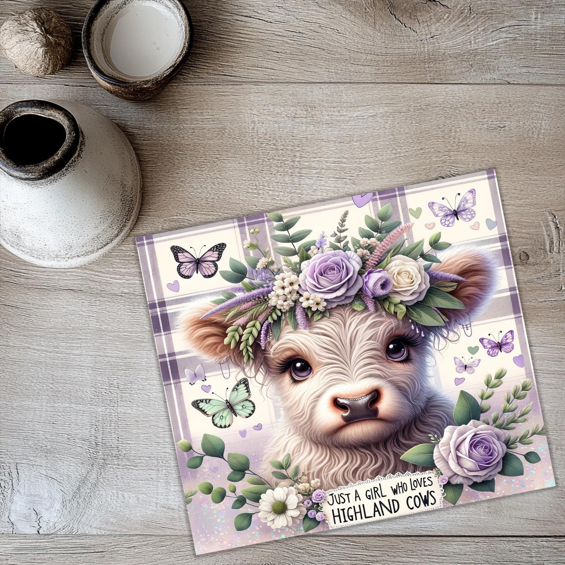 a card with a picture of a cow wearing a flower crown
