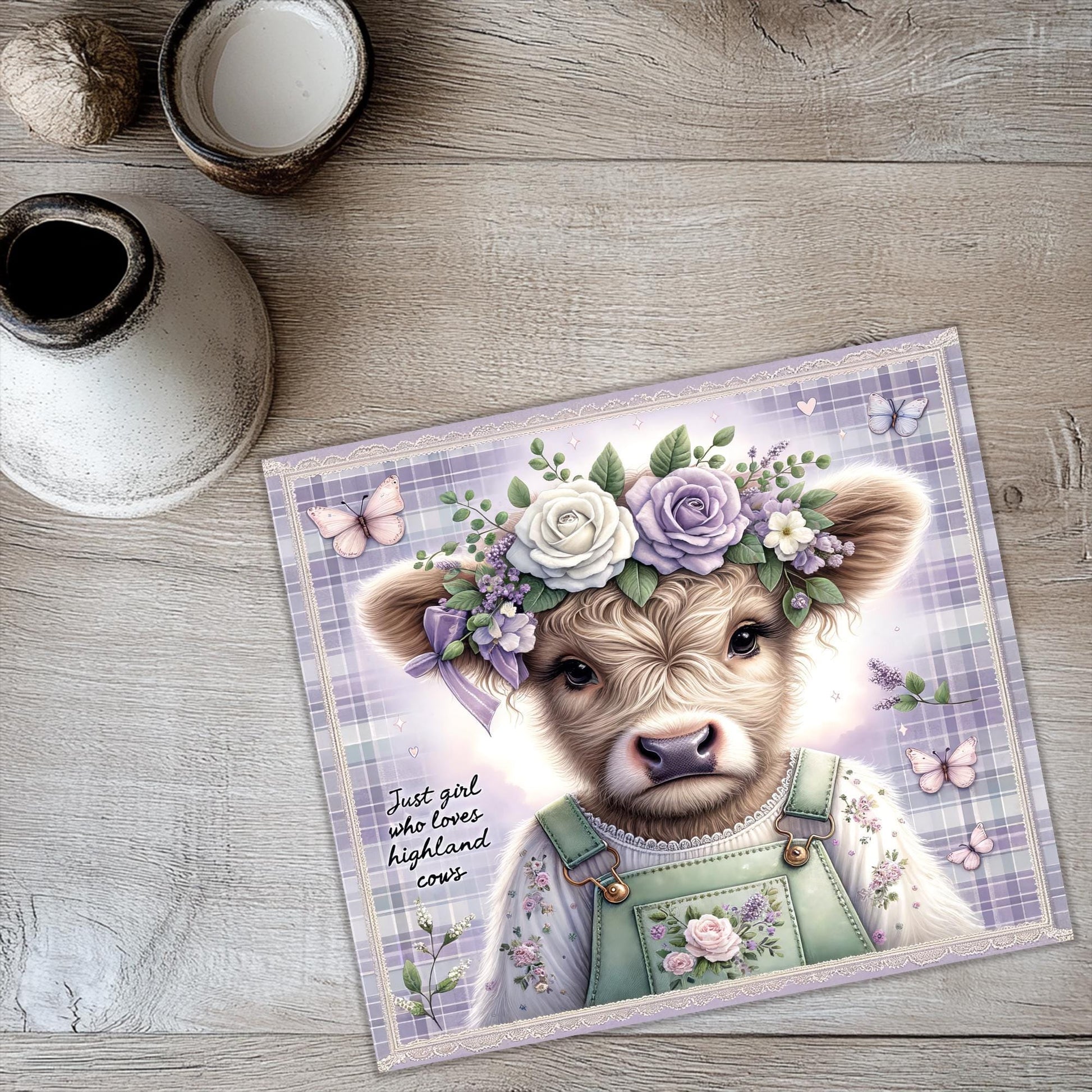 a card with a picture of a cow wearing a flower crown