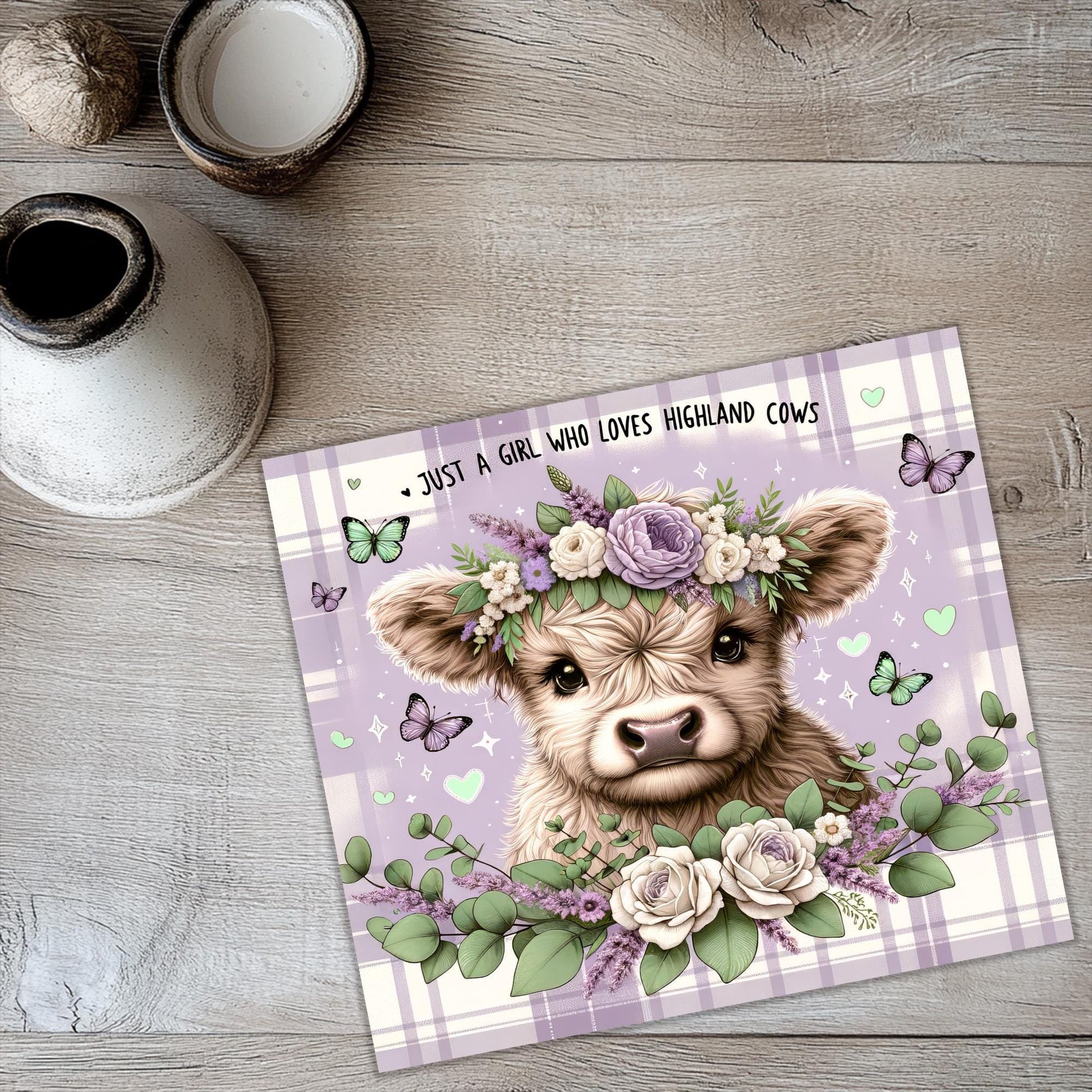 a card with a picture of a cow wearing a flower crown