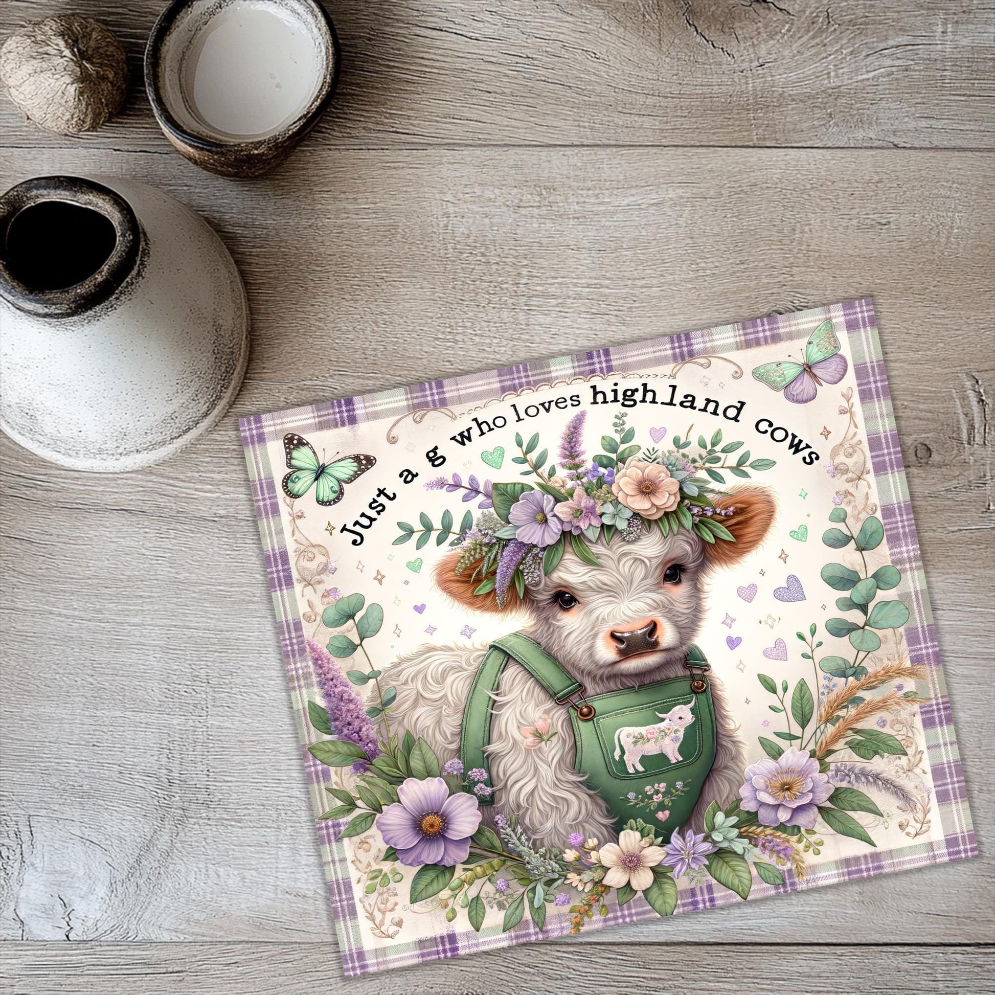 a card with a picture of a cow wearing a flower crown