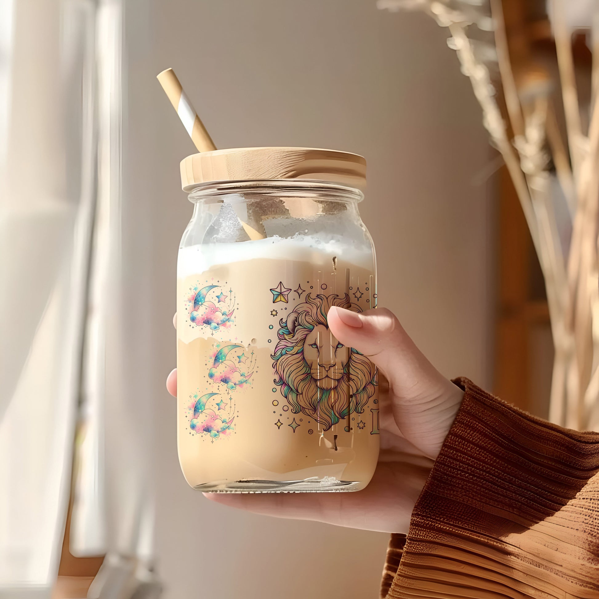 a person holding a jar with a straw in it