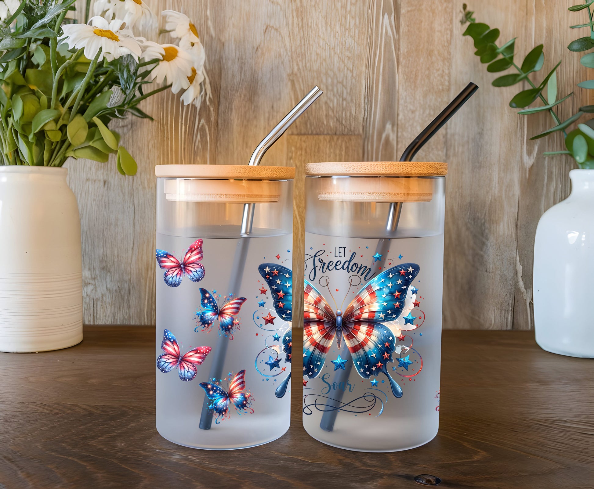 a couple of glass cups sitting on top of a wooden table