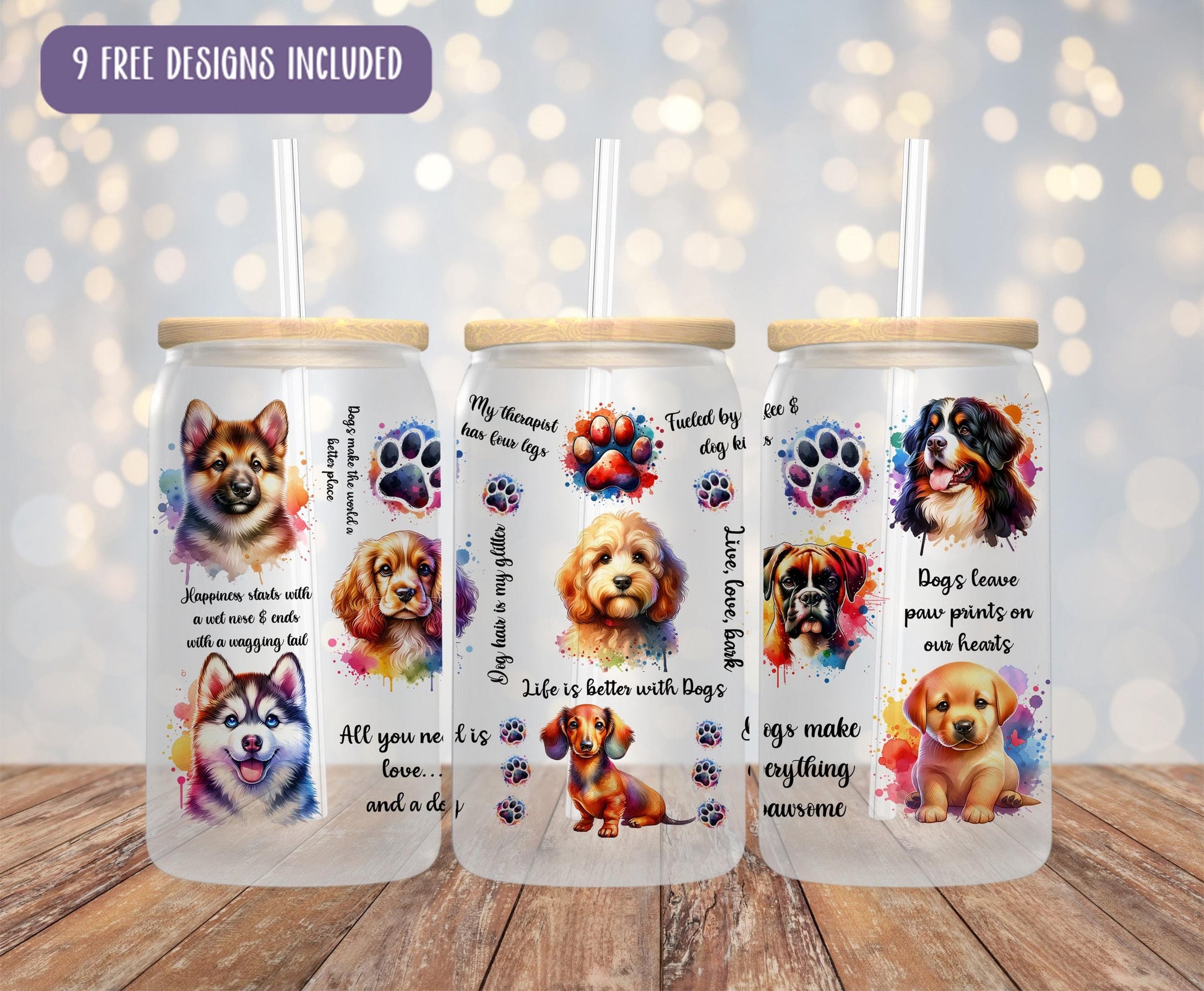 a set of three dog themed tumblers on a wooden table