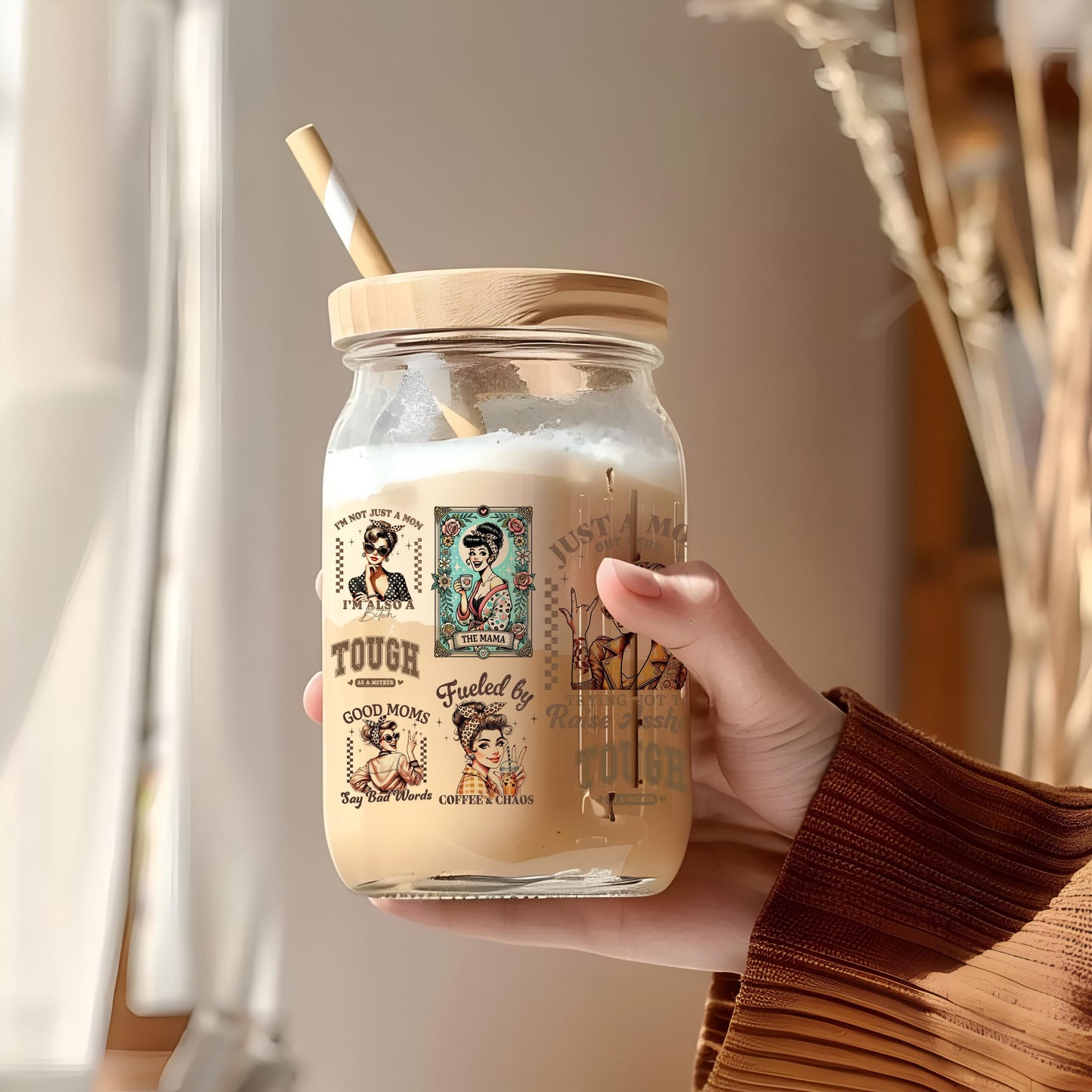 a person holding a jar with a straw in it
