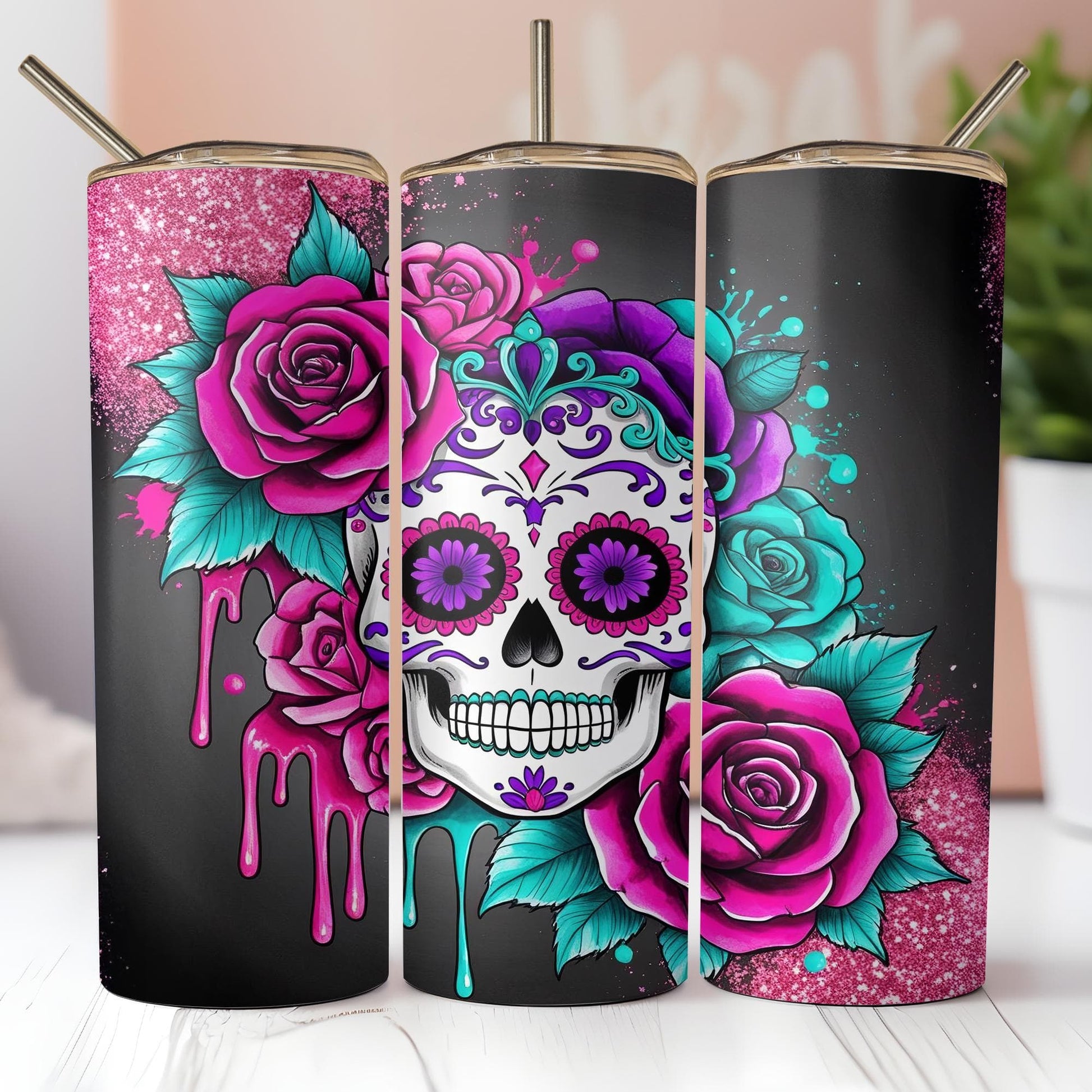 a group of three tumbles decorated with sugar skulls and roses