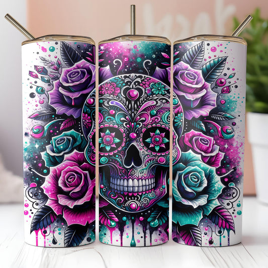 three colorful sugar skulls with roses on them