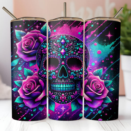 three colorful skulls with roses on them on a table