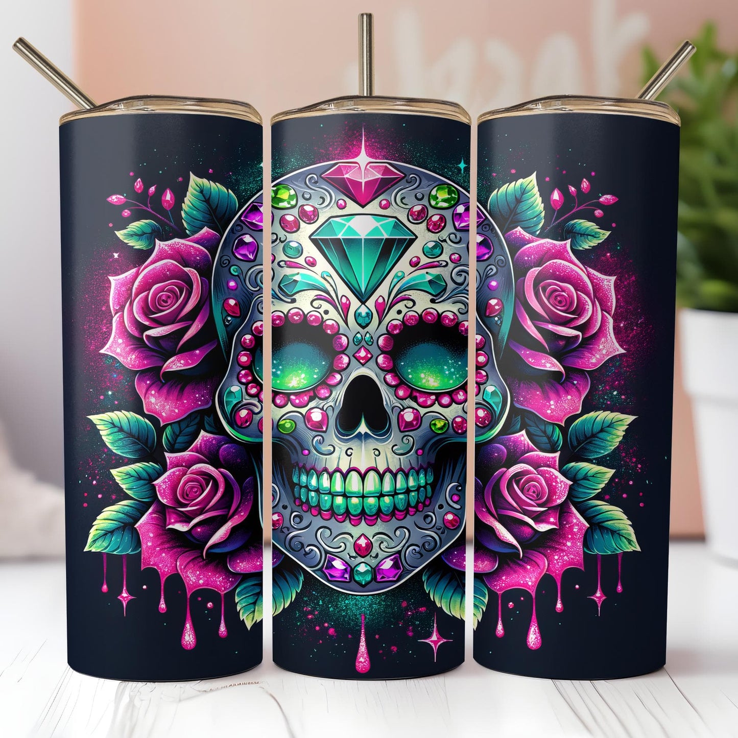 a set of three tumbles with a sugar skull and roses on them