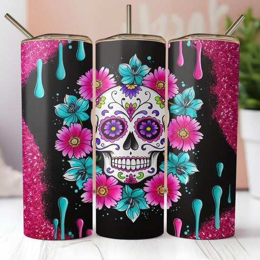 three colorful sugar skulls with flowers on them