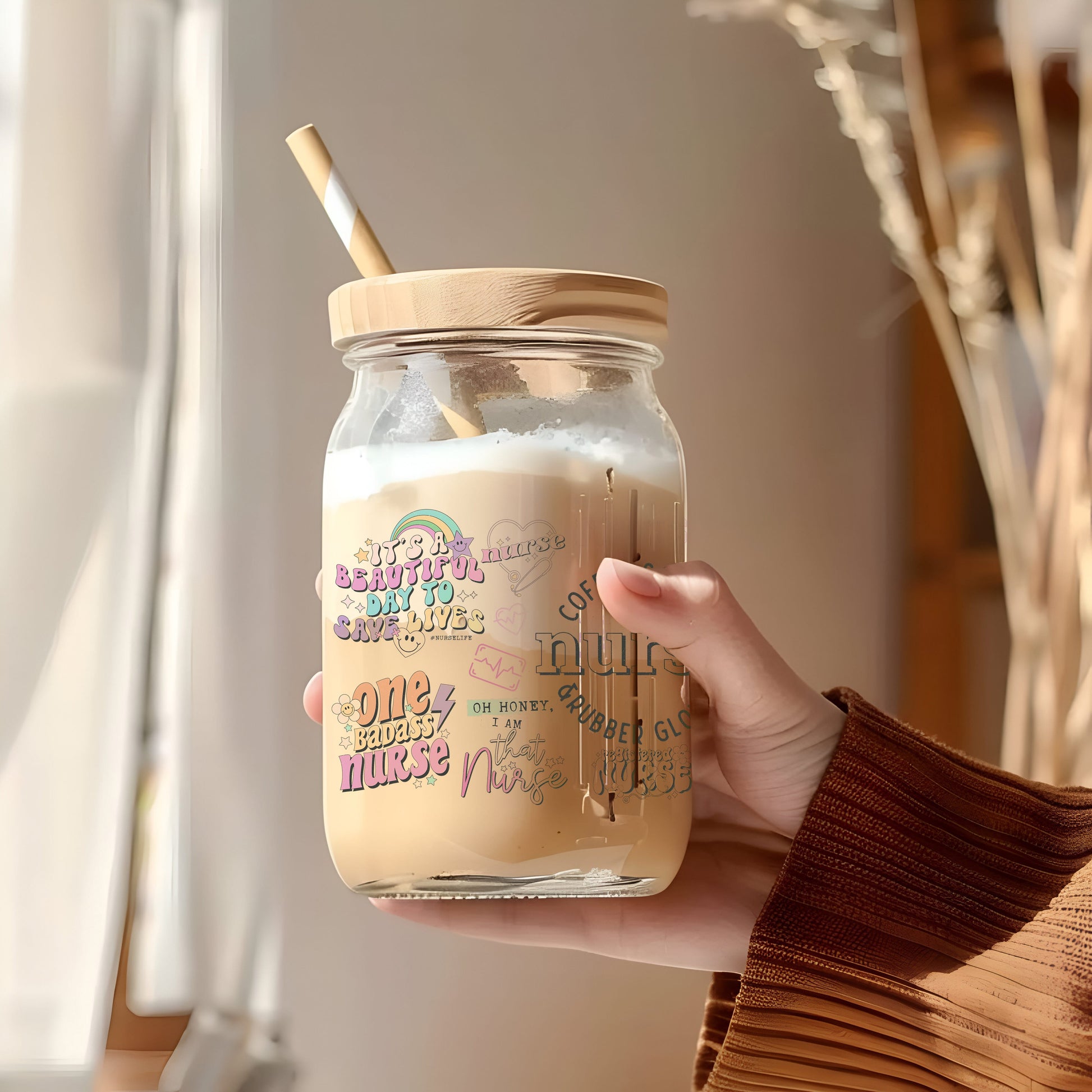 a person holding a jar with a straw in it