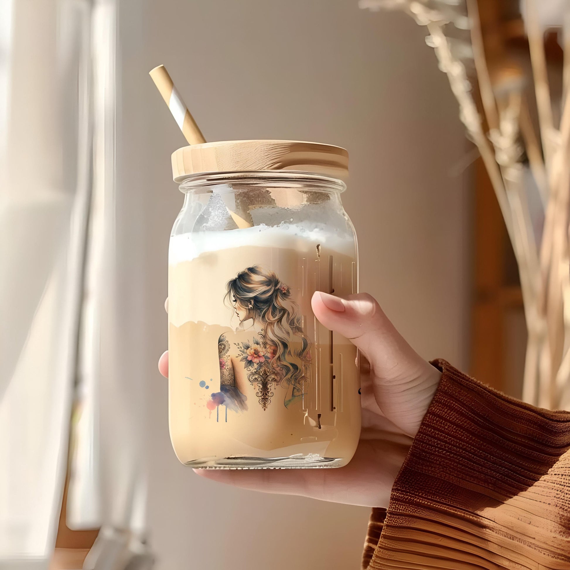 a person holding a jar with a straw in it