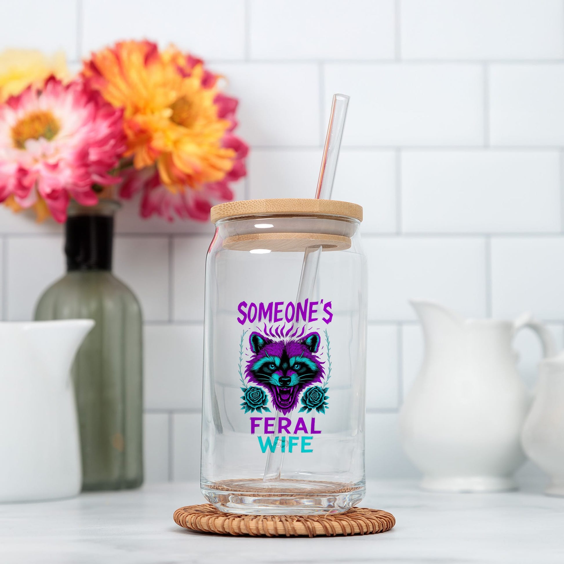 a glass jar with a straw in it sitting on a counter