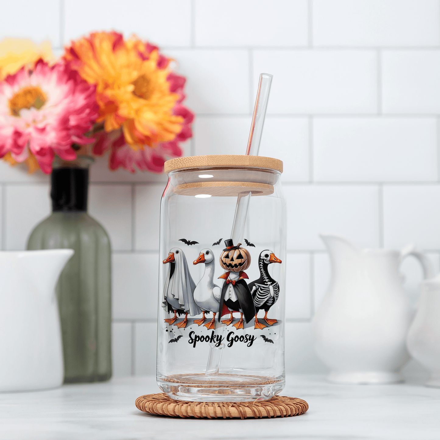a glass jar with a straw in it sitting on a counter