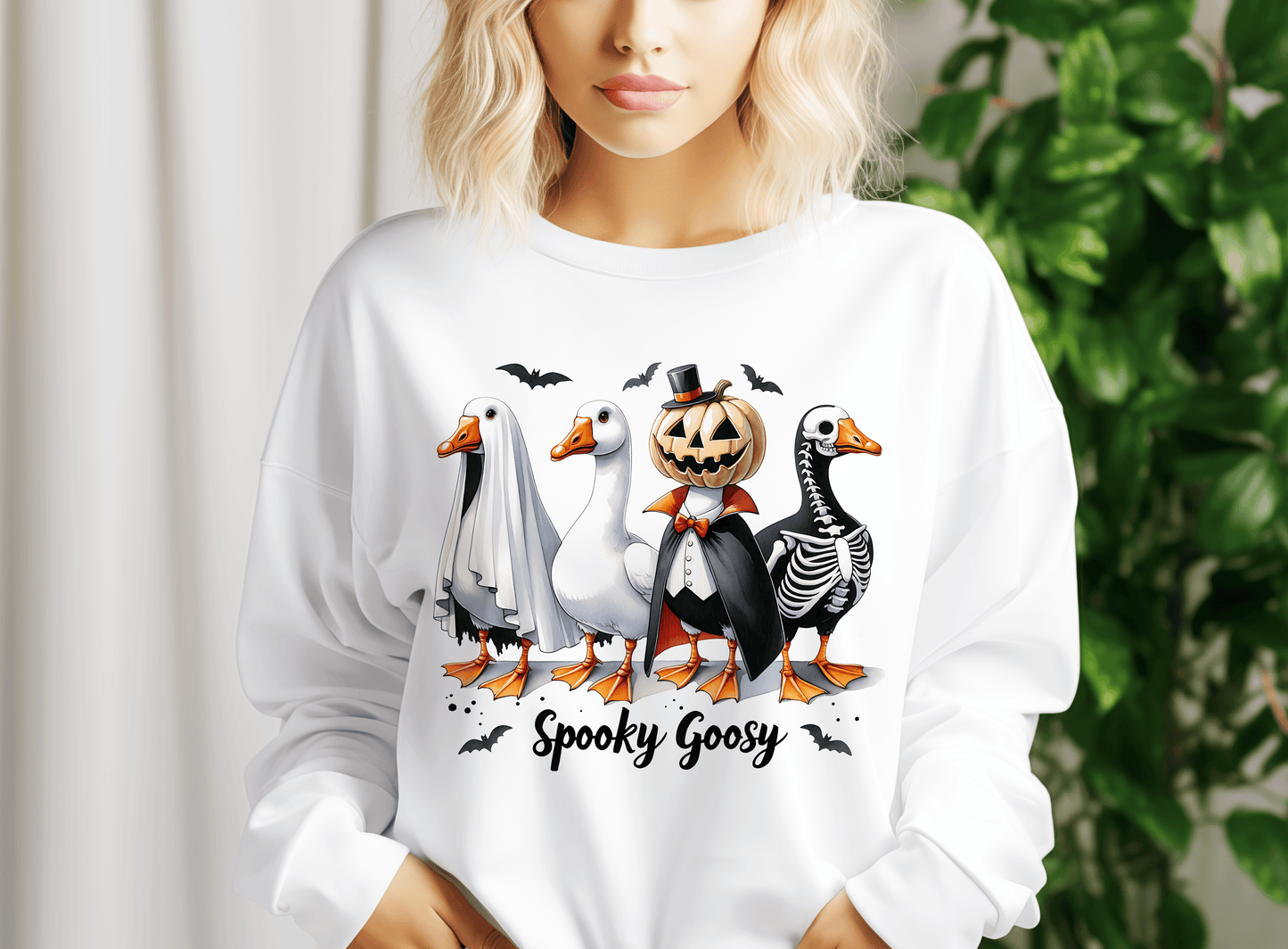 a woman wearing a white shirt with a picture of ducks and geese on it