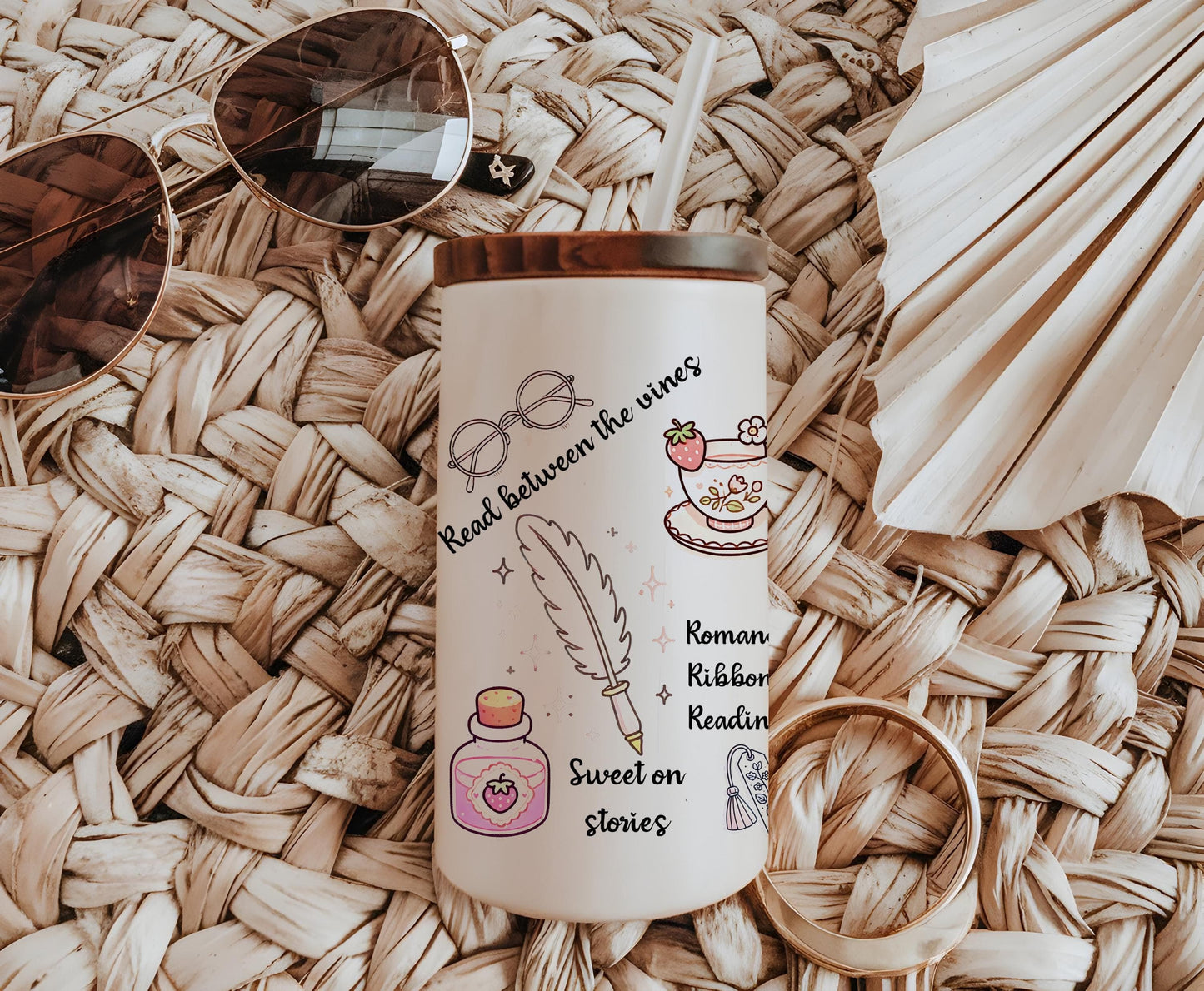 a coffee cup with a straw hat and sunglasses on top of it