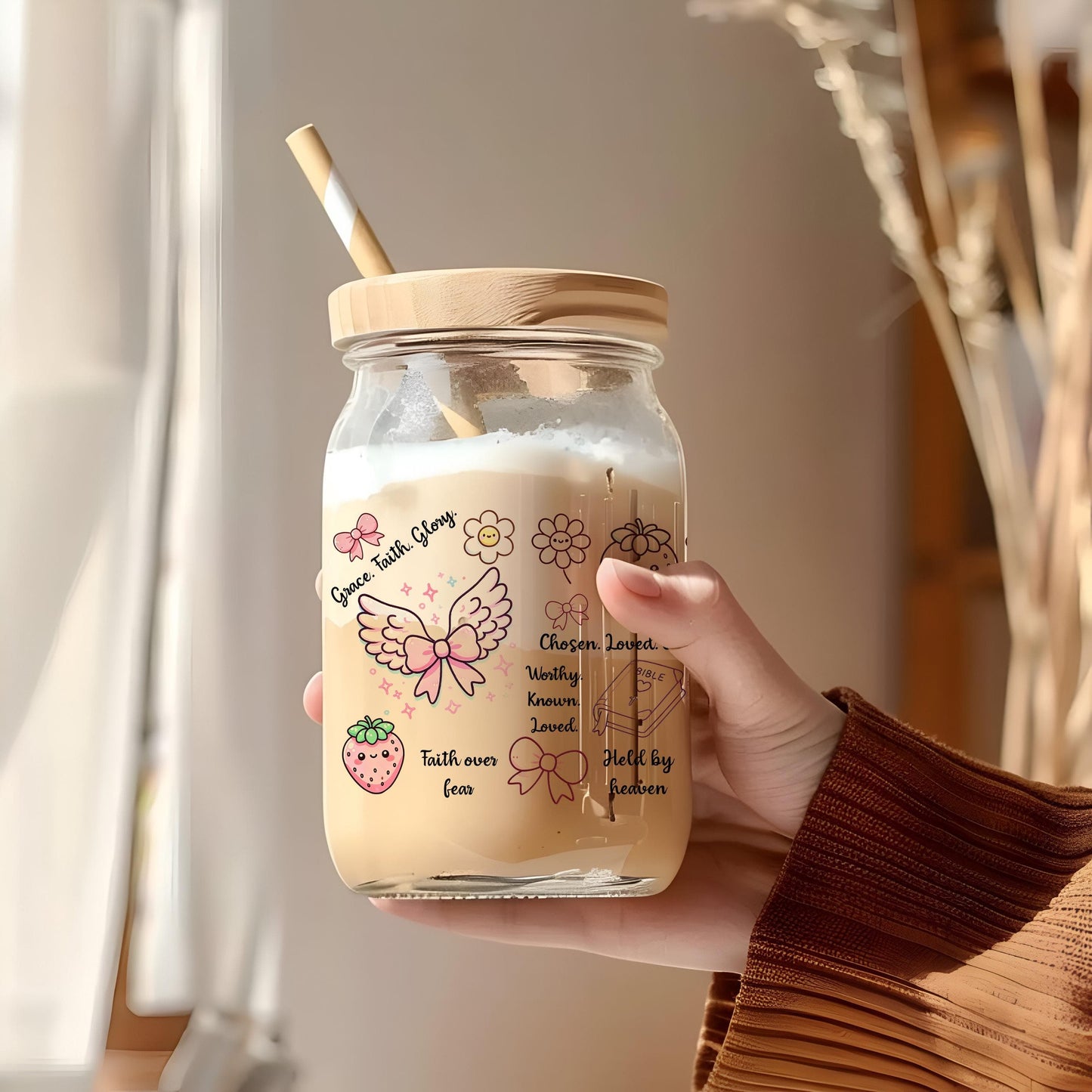 a person holding a jar with a straw in it