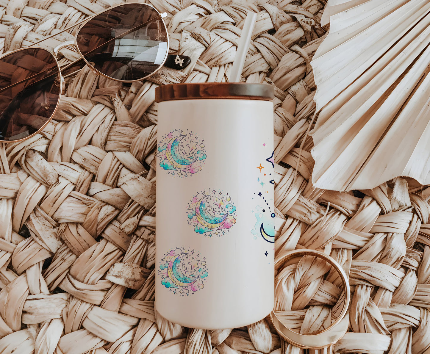 a white coffee cup sitting on top of a wicker table